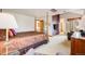 Spacious bedroom features a four-poster bed and ample space for additional furnishings at 1579 W Briarwood Ave, Littleton, CO 80120