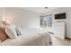 Bright bedroom with large windows and white walls at 1579 W Briarwood Ave, Littleton, CO 80120