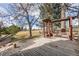 Large wooden deck with pergola and built-in seating in a landscaped backyard at 1579 W Briarwood Ave, Littleton, CO 80120