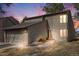Charming two-story home featuring stone accents, neutral siding and an attached two-car garage at 1579 W Briarwood Ave, Littleton, CO 80120