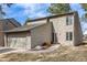 Charming two-story home featuring stone accents, neutral siding and an attached two-car garage at 1579 W Briarwood Ave, Littleton, CO 80120