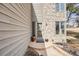 Close up of front porch showcasing stone accents, manicured landscaping, and inviting entry at 1579 W Briarwood Ave, Littleton, CO 80120