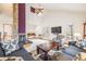 Bright and airy living room featuring a stone fireplace and vaulted ceiling at 1579 W Briarwood Ave, Littleton, CO 80120