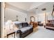 Sitting area in main bedroom with comfortable sofa and built-ins at 1579 W Briarwood Ave, Littleton, CO 80120