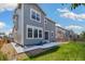 The home's backyard includes a patio, grass, and a wooden fence surrounding the property at 10983 Uvalda St, Commerce City, CO 80022