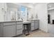 Bright bathroom showcasing dual vanities with stylish countertops and ample storage at 10983 Uvalda St, Commerce City, CO 80022