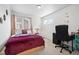 Serene bedroom with a cozy bed, desk area, and soft lighting at 10983 Uvalda St, Commerce City, CO 80022