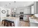 Stylish kitchen featuring granite countertops, stainless steel appliances, and a center island with seating at 10983 Uvalda St, Commerce City, CO 80022