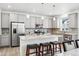Modern kitchen with granite countertops, stainless steel appliances, and a center island at 10983 Uvalda St, Commerce City, CO 80022