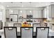Modern kitchen with granite countertops, stainless steel appliances and view to the dining area at 10983 Uvalda St, Commerce City, CO 80022