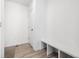 Mudroom with hardwood floors and a built-in bench is an excellent space for storage at 10983 Uvalda St, Commerce City, CO 80022