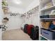 Well-organized walk-in closet with shelving and space for storage and organization at 10983 Uvalda St, Commerce City, CO 80022