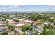 Neighborhood aerial view with lush greenery, city, and mountain views in the background at 3908 Mariposa St, Denver, CO 80211