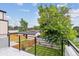 Backyard view from the balcony showcasing the lawn, fencing, and greenery at 3908 Mariposa St, Denver, CO 80211