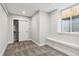Cozy bedroom with neutral colors, new carpet, a built-in bench beneath the window, and a closet at 3908 Mariposa St, Denver, CO 80211