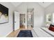 Spacious bedroom with a view to the bathroom, providing ample space and natural light at 3908 Mariposa St, Denver, CO 80211