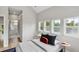 Bright bedroom with ample natural light and a glimpse of the en-suite bathroom at 3908 Mariposa St, Denver, CO 80211