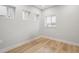 Bright bedroom with hardwood floors and natural light, showcasing a clean and modern aesthetic at 3908 Mariposa St, Denver, CO 80211
