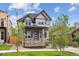 Beautiful new two-story home with a covered porch and professional landscaping at 3908 Mariposa St, Denver, CO 80211