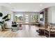 Stylish living room with hardwood floors, large windows, and modern fireplace at 3908 Mariposa St, Denver, CO 80211