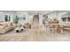 Bright, open-concept living and dining area with hardwood floors and modern decor at 3908 Mariposa St, Denver, CO 80211