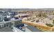 Aerial view showcasing the community, surrounding amenities, and the modern rooftop decks at 12283 W 57Th Ln, Arvada, CO 80002