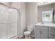 Modern bathroom with a glass-enclosed shower, sleek vanity, and contemporary fixtures at 12283 W 57Th Ln, Arvada, CO 80002