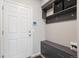 Welcoming entryway with built-in storage, bench seating, and modern organizational features at 12283 W 57Th Ln, Arvada, CO 80002