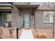 Inviting front entrance with stylish brickwork and clean landscaping at 12283 W 57Th Ln, Arvada, CO 80002