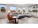 Bright living room with large windows, plush seating, and stylish decor creating a welcoming atmosphere at 12283 W 57Th Ln, Arvada, CO 80002