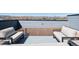 Open rooftop deck with ample seating and panoramic views of the surrounding landscape at 12283 W 57Th Ln, Arvada, CO 80002