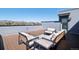 Inviting rooftop deck featuring comfortable seating and scenic mountain views at 12283 W 57Th Ln, Arvada, CO 80002