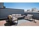 Stylish rooftop deck with comfortable seating, perfect for outdoor relaxation and entertaining at 12283 W 57Th Ln, Arvada, CO 80002