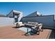 Relaxing rooftop deck with modern furniture, ideal for enjoying sunny days and fresh air at 12283 W 57Th Ln, Arvada, CO 80002
