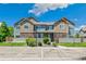Attractive townhome exterior featuring well-maintained landscaping, stone accents, and convenient parking at 12860 Jasmine St # C, Thornton, CO 80602