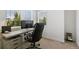 Functional office space with a comfortable chair, a desk with a computer, and neutral carpet at 12860 Jasmine St # C, Thornton, CO 80602