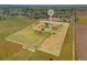 Aerial view of an 8.7 acre lot for sale including structures, lawn and trees at 14475 Lanewood St, Brighton, CO 80603