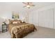 Cozy bedroom featuring a ceiling fan, closet, and stylish bedding, creating a comfortable and inviting atmosphere at 14475 Lanewood St, Brighton, CO 80603