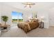 Bright bedroom with a sliding glass door and views of the outdoors at 14475 Lanewood St, Brighton, CO 80603