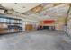 Garage interior with shelving, cabinet storage and concrete floors at 14475 Lanewood St, Brighton, CO 80603