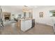 Open kitchen and living room with wood floors and modern decor at 14475 Lanewood St, Brighton, CO 80603