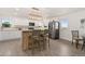 Kitchen with a wooden island, stainless steel appliances, and views of the countryside at 14475 Lanewood St, Brighton, CO 80603