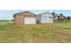 An exterior view of detached garage and workshop at 14475 Lanewood St, Brighton, CO 80603