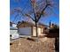 Charming single-story home featuring an attached garage and a well-maintained front yard with a beautiful tree at 9530 Devon Ct, Highlands Ranch, CO 80126