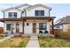 Charming exterior of a modern two-story home with a covered porch and well-maintained lawn at 2571 S Cherokee St, Denver, CO 80223