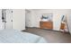 Spacious main bedroom with carpet, wood dresser, and modern decor for comfortable living at 2571 S Cherokee St, Denver, CO 80223