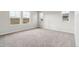 Carpeted bedroom with three windows for natural light at 39731 Congress Ln, Elizabeth, CO 80107