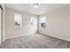 Carpeted bedroom featuring three windows at 39731 Congress Ln, Elizabeth, CO 80107