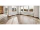 Bright living room with hardwood floors and large windows showcasing the surroundings at 39731 Congress Ln, Elizabeth, CO 80107