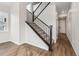 Staircase with carpet runner and metal railing at 39731 Congress Ln, Elizabeth, CO 80107